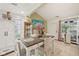Bright dining room with stylish decor, lots of natural light, a modern table, and an open floor plan at 6627 Cobden Ct, Indianapolis, IN 46254