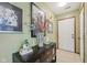 Inviting entryway with tiled flooring, decorative table, and stylish artwork creating a warm welcome at 6627 Cobden Ct, Indianapolis, IN 46254