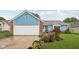 Charming single Gathering home with blue siding, brick accents, and a well-manicured front yard with roses at 6627 Cobden Ct, Indianapolis, IN 46254