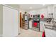 Well-equipped kitchen with stainless steel appliances, ample counter space, and crisp white cabinets at 6627 Cobden Ct, Indianapolis, IN 46254