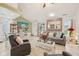 Cozy living room with tile floors, neutral paint colors, comfortable furnishings, and lots of natural light at 6627 Cobden Ct, Indianapolis, IN 46254