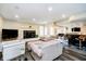 Basement living room boasts a fireplace, seating area, bar, and entertainment space for gatherings at 6630 Travis Rd, Greenwood, IN 46143
