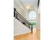 Elegant foyer featuring a grand staircase, chandelier, and a large window offering natural light at 6630 Travis Rd, Greenwood, IN 46143