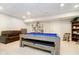 Finished basement game room with a pool table and ample space for entertaining at 6630 Travis Rd, Greenwood, IN 46143