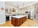 Gourmet kitchen with a large center island, stainless steel appliances, and custom cabinetry at 6630 Travis Rd, Greenwood, IN 46143