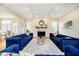 Inviting living room with coffered ceilings, fireplace, and stylish blue couches at 6630 Travis Rd, Greenwood, IN 46143