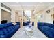 Spacious living room with large windows and a staircase visible, adorned with elegant furnishings at 6630 Travis Rd, Greenwood, IN 46143