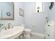 Chic powder room with a white vanity, modern fixtures, and neutral decor at 6630 Travis Rd, Greenwood, IN 46143