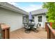 This is a wooden back deck with outdoor furniture and an umbrella at 6737 Raritan Dr, Indianapolis, IN 46221