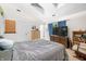 Comfortable bedroom with vaulted ceilings, dresser, and a bed at 6737 Raritan Dr, Indianapolis, IN 46221