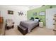 Relaxing bedroom with a plush bed, chair, and stylish decor at 6737 Raritan Dr, Indianapolis, IN 46221