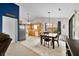 Open-concept dining area features a wooden table, kitchen access, and plenty of sunlight at 6737 Raritan Dr, Indianapolis, IN 46221