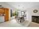 Bright dining room with a wooden table, sliding doors, and tiled flooring at 6737 Raritan Dr, Indianapolis, IN 46221