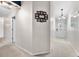 Bright hallway featuring a gallery wall leading to a view of the front door at 6737 Raritan Dr, Indianapolis, IN 46221