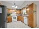 Charming kitchen with abundant wood cabinets and modern appliances, perfect for cooking and entertaining guests at 6737 Raritan Dr, Indianapolis, IN 46221