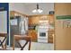 Inviting kitchen with ample cabinet space, stainless steel refrigerator, and functional design for cooking convenience at 6737 Raritan Dr, Indianapolis, IN 46221