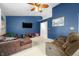 Spacious living room with plush furnishings and neutral carpet, offering a comfortable and inviting space for relaxation at 6737 Raritan Dr, Indianapolis, IN 46221