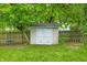 Charming backyard shed with double doors and a well-maintained lawn at 6737 Raritan Dr, Indianapolis, IN 46221