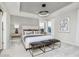 Serene main bedroom with tray ceiling, carpet, natural light, and elegant furnishings at 6761 Seabiscuit Rd, Whitestown, IN 46075