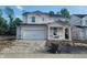 Unfinished two-story home with attached garage and covered entry offers a glimpse of future possibilities at 6849 Seabiscuit Rd, Whitestown, IN 46075