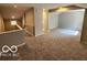 Large bedroom featuring neutral paint, plush carpeting, and an open floor plan at 70 Lookout Ridge Dr, Columbus, IN 47201