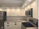 Well-lit kitchen with white cabinets, stainless steel appliances, and modern finishes at 70 Lookout Ridge Dr, Columbus, IN 47201