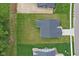 Aerial view of home showcasing the roof, driveway and surrounding yard at 7051 E Bean Blossom Dr, Camby, IN 46113