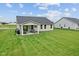 Backyard featuring a patio and green lawn at 7051 E Bean Blossom Dr, Camby, IN 46113