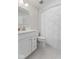 Bright bathroom with a white vanity, modern faucet, and a stylish shower curtain adding texture to the space at 7051 E Bean Blossom Dr, Camby, IN 46113