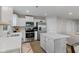 Bright kitchen featuring white cabinets, stainless steel appliances, and a center island at 7051 E Bean Blossom Dr, Camby, IN 46113