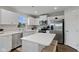 Contemporary kitchen with white cabinets, quartz countertops, and stainless steel appliances at 7051 E Bean Blossom Dr, Camby, IN 46113