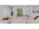 Comfortable living room featuring a plush sectional sofa and a wall-mounted television at 7051 E Bean Blossom Dr, Camby, IN 46113