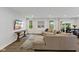 Open living room showcasing recessed lighting, neutral tones, and a large sectional sofa for comfortable living at 7051 E Bean Blossom Dr, Camby, IN 46113
