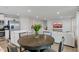 Open-concept kitchen, dining, and living area, perfect for modern living and entertaining at 7051 E Bean Blossom Dr, Camby, IN 46113