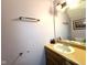 This bathroom features a single sink with a mirrored wall and a towel rack at 7445 Melanie Ln, Indianapolis, IN 46217