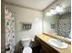 A bathroom featuring a shower with a seashell themed curtain and a single sink at 7445 Melanie Ln, Indianapolis, IN 46217