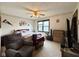 This bedroom features a ceiling fan, a bed, and a window with natural light at 7445 Melanie Ln, Indianapolis, IN 46217