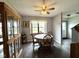 Charming dining room with a wooden table, display cabinet, and a ceiling fan at 7445 Melanie Ln, Indianapolis, IN 46217