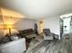 Spacious living room with comfortable seating, wood-look flooring, and neutral décor at 7445 Melanie Ln, Indianapolis, IN 46217
