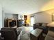 Cozy living room featuring a fireplace, comfortable seating, and modern flooring at 7445 Melanie Ln, Indianapolis, IN 46217
