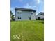 Spacious, well-maintained backyard featuring a lush green lawn behind the home at 7549 Stockard St, Indianapolis, IN 46239