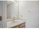 Small bathroom with a single sink, wood cabinet, and white walls providing a clean and functional space at 7549 Stockard St, Indianapolis, IN 46239