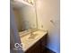 Bathroom view with a single sink vanity, neutral countertop, classic mirror, and standard toilet at 7549 Stockard St, Indianapolis, IN 46239