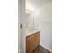Cozy half bath featuring wood cabinets and single sink, offering functionality in a compact design at 7549 Stockard St, Indianapolis, IN 46239
