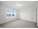 Bright bedroom with carpet and light walls, and a window that enhances the natural light and creates an open atmosphere at 7549 Stockard St, Indianapolis, IN 46239