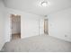 Bright bedroom with plush carpet, closet and white painted walls, creating a cozy and inviting atmosphere at 7549 Stockard St, Indianapolis, IN 46239