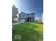 Two-story home with a two-car garage and landscaped front yard at 7549 Stockard St, Indianapolis, IN 46239