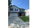 Two-story home with a two-car garage and concrete driveway at 7549 Stockard St, Indianapolis, IN 46239