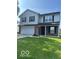 Two-story home featuring a two-car garage and well-maintained lawn at 7549 Stockard St, Indianapolis, IN 46239
