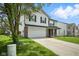 Inviting two-story home with attached garage, brick accents, and well-manicured front lawn at 7549 Stockard St, Indianapolis, IN 46239